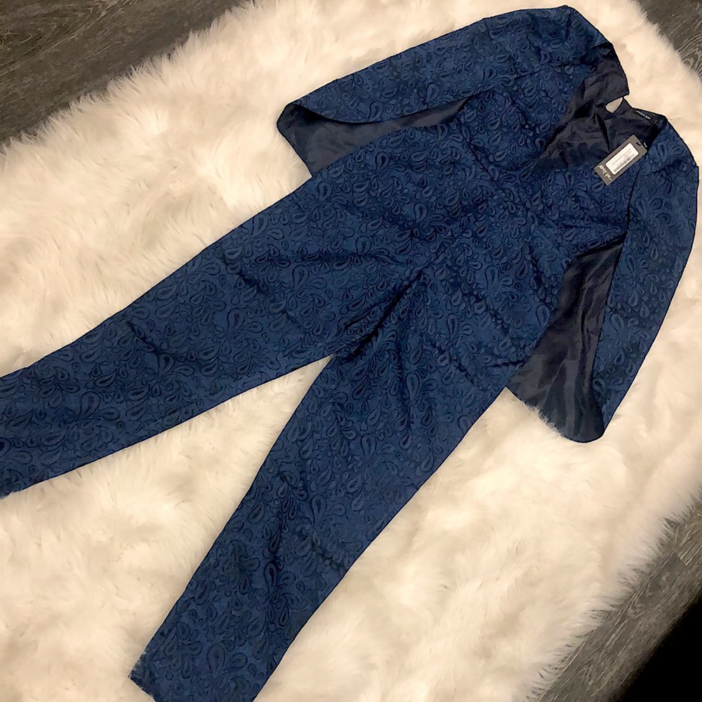 Navy blue gorgeous printed jumpsuit with attached keep a beautiful pattern.